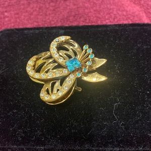 Vintage gold/blue stones, and crystal brooch.